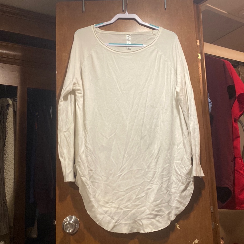 Cream color long sleeve, sweater, cashmere feeling with a scoop bottom